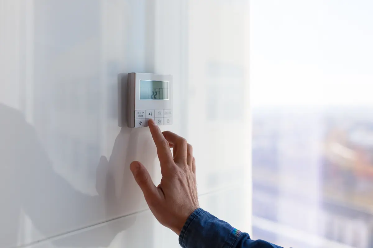 HVAC technician servicing an indoor air-conditioning unit